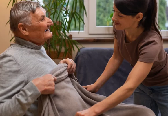 elderly-person-being-taken-care-by-female-caretaker