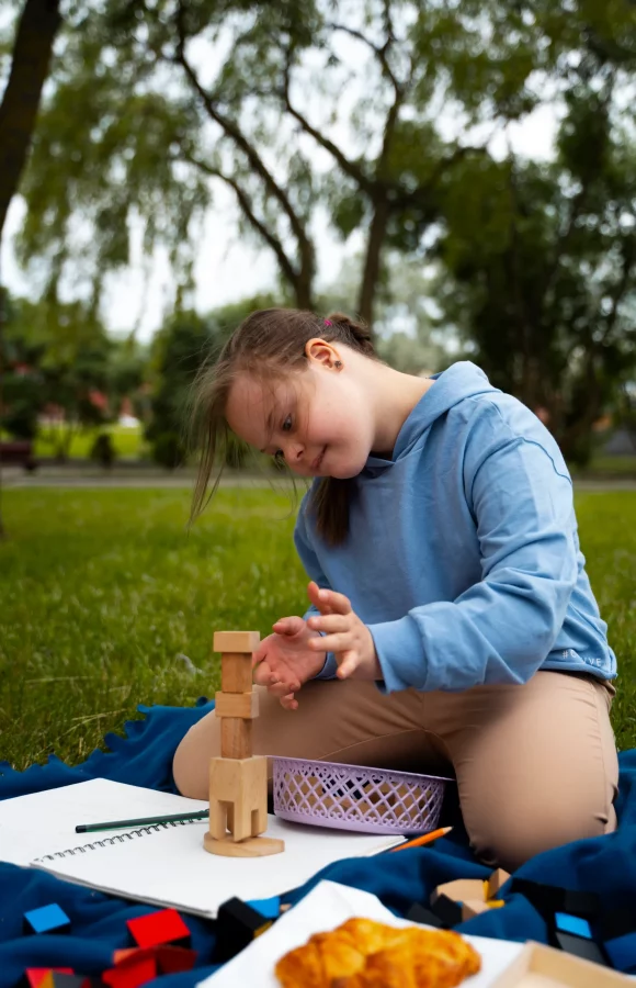 full-shot-girl-playing-with-wooden-toys
